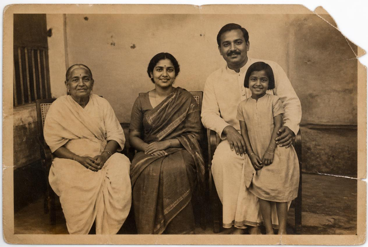 Before restoration: A 1920s family print with its corner restored