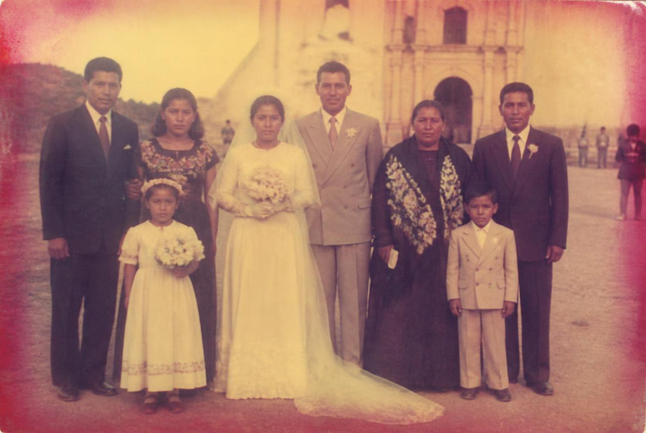 Before restoration: A 1940s wedding group, gently brought back