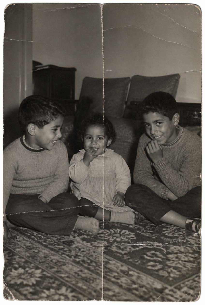 Before restoration: Three children behind a repaired fold